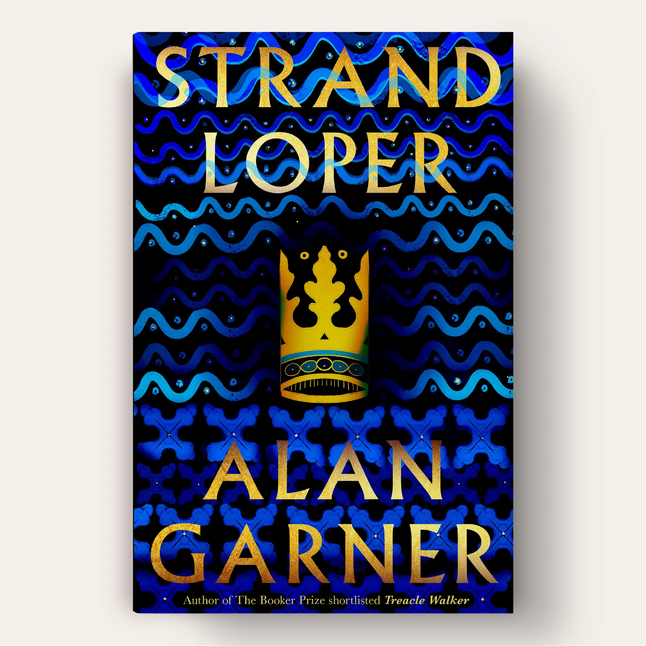 A blue book cover with indigenous wavy patterns and an illustration of the crown in the middle.